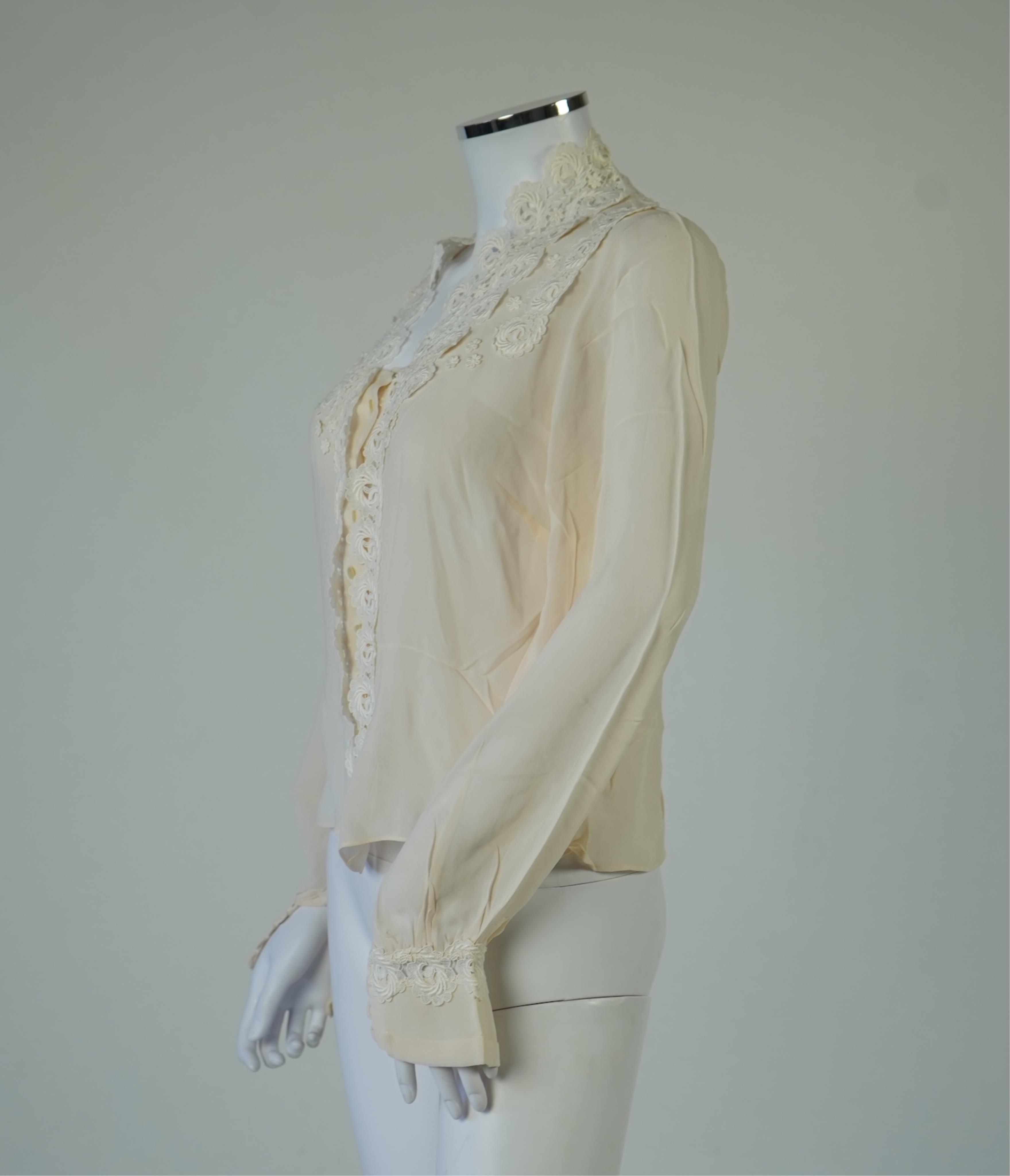 A 1940’s-50’s short sleeve lime green silk embroidered blouse, a pale pink silk crepe long sleeved blouse with white lace and a late 19th century navy silk chiffon blouse. Condition - the navy blouse is fragile but may b